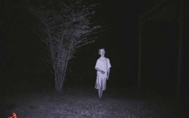 A child in pajamas caught on a trail cam