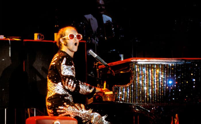 Elton John performs live on stage.