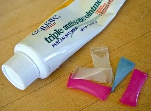 Straw cut into small pieces with ointment inside them 
