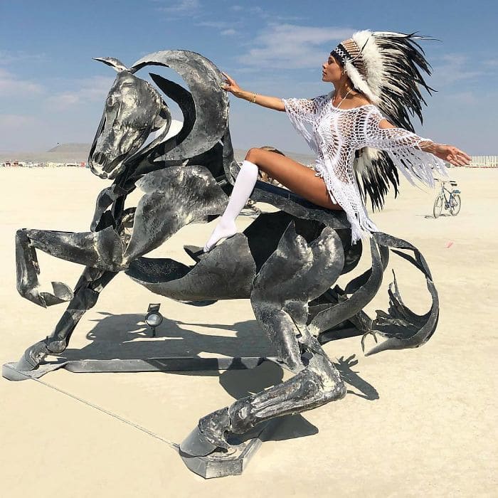 Woman riding a sculpted horse