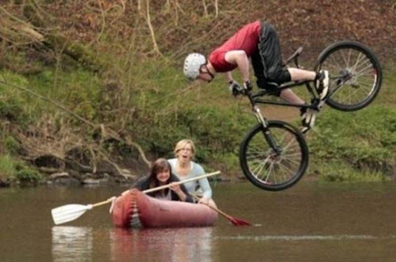 Bike rider falling into a lake