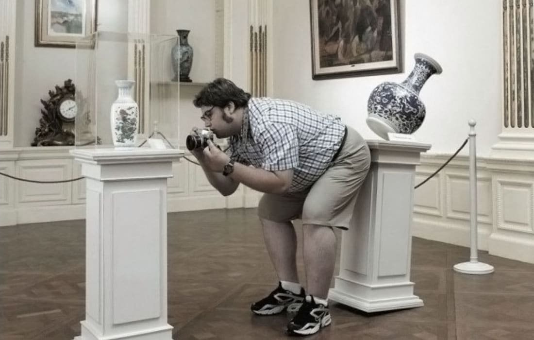 Man taking a photo in a museum 