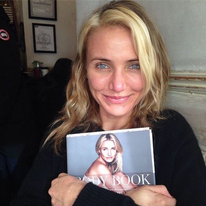 Cameron Diaz holding a magazine with her on the cover