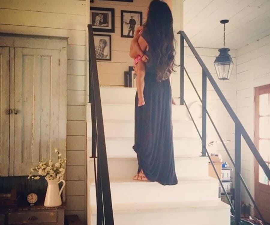 Joanna Gaines on stairs in the house 