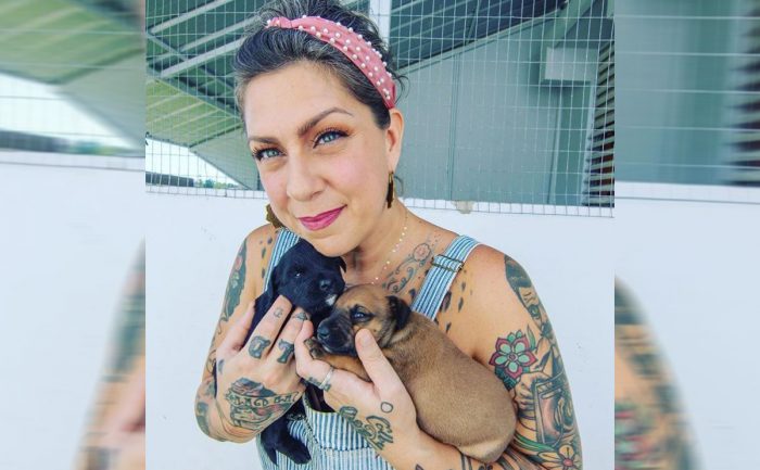 Danielle Colby holding puppies
