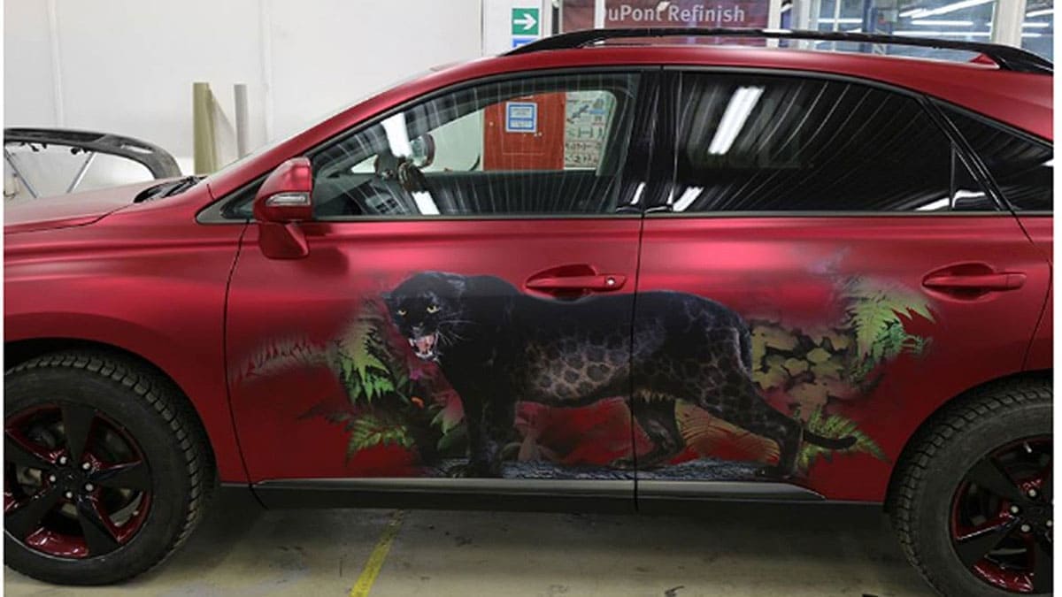 Jaguar painting on the side of a car