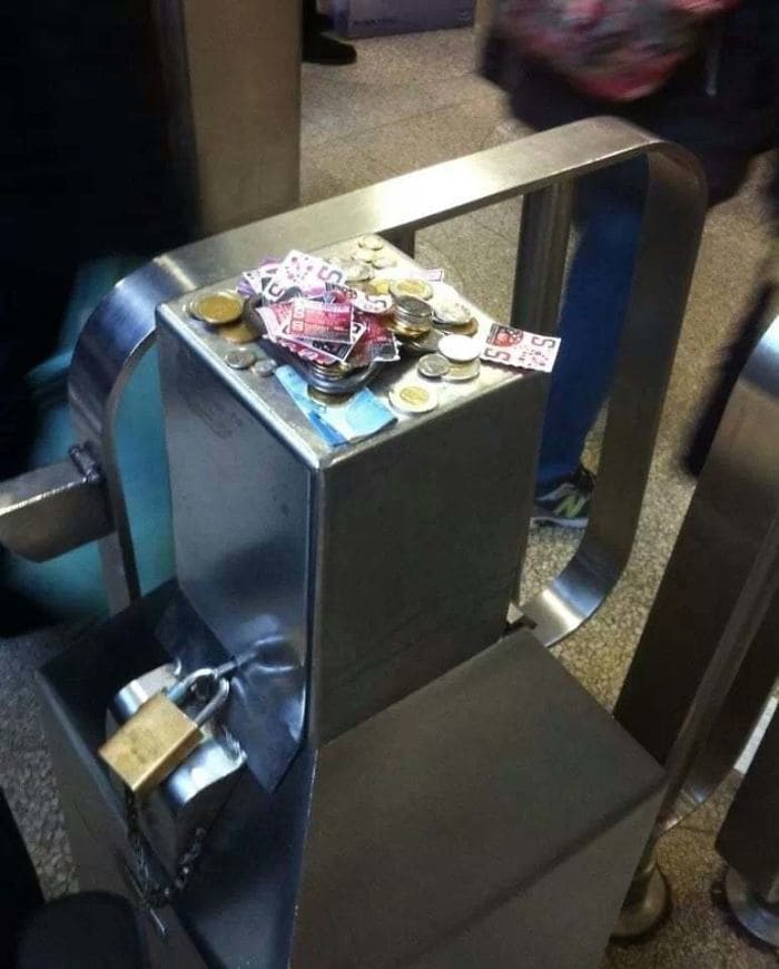 Subway ticket stand with cash on it