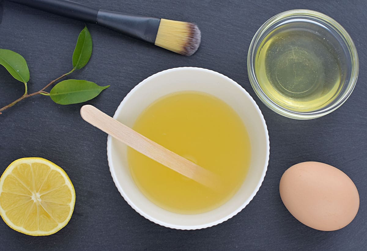Acne skin treatment, homemade facial mask with egg white and lemon juice.