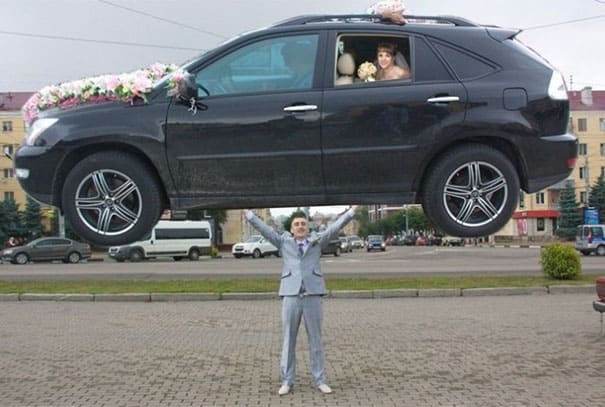 photoshopped image on groom holding up a car with the bride in it 