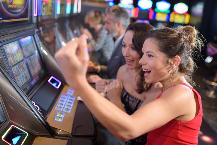women winning at slot machine