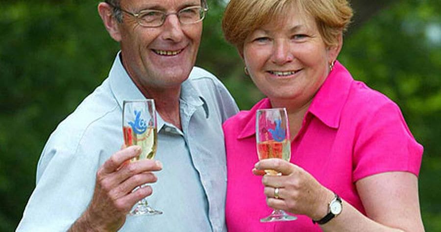 Louise Gough and husband Keith celebrating after receiving their winning lottery check. 