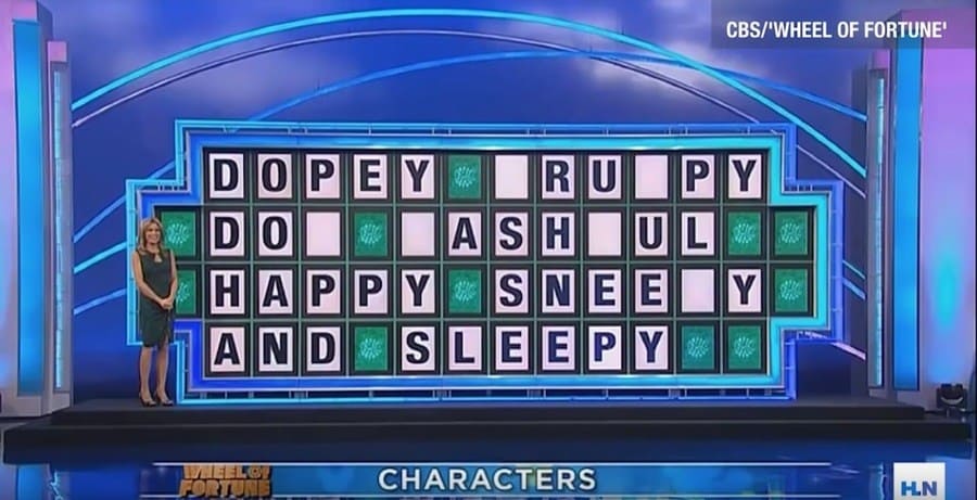 Wheel of Fortune puzzle reading “DOPEY _RU_PY DO_ _ASH_UL HAPPY SNEE_Y AND SLEEPY”