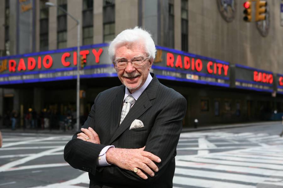 Charlie O’Donnell standing in front of Radio City 