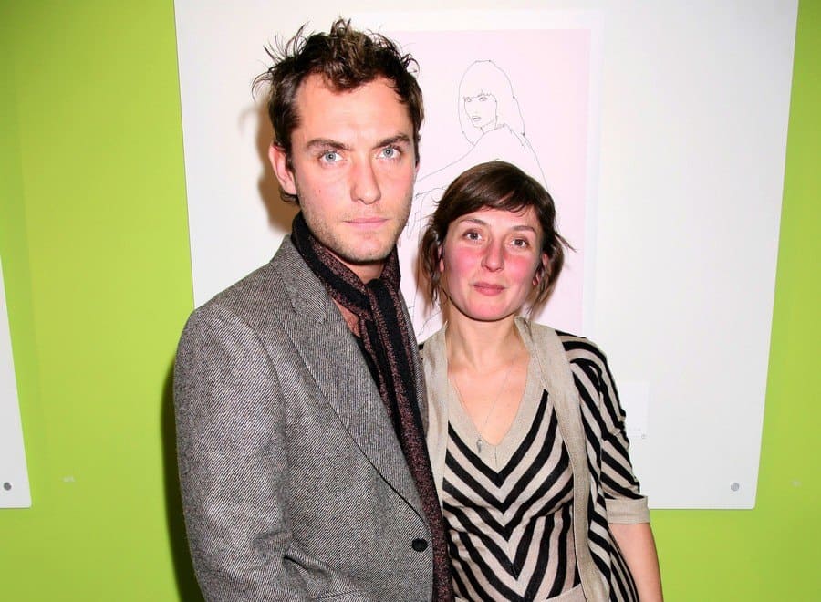 Jude and Natasha Law were standing in front of their artwork. 
