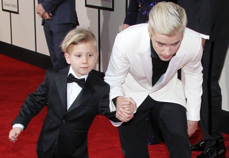 Justin and Jaxon Bieber at the 58th Annual Grammy Awards. 
