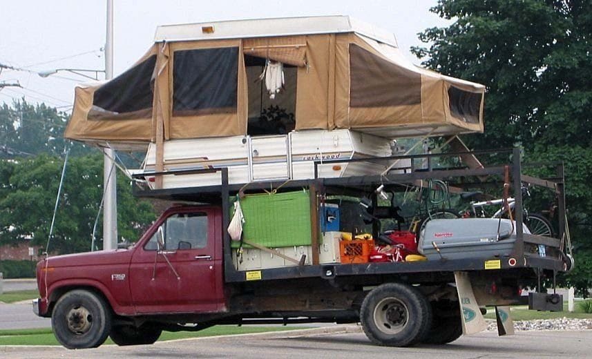Truck with a camper installed on top of it