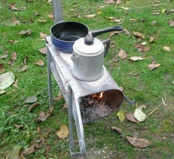 Metal mailbox used as a grill for cooking 