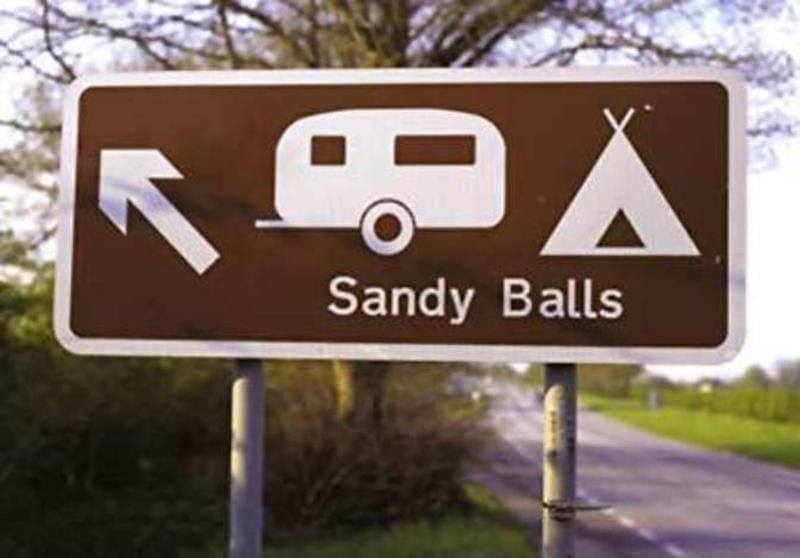 sign that reads “Sandy Balls” as a campsite 