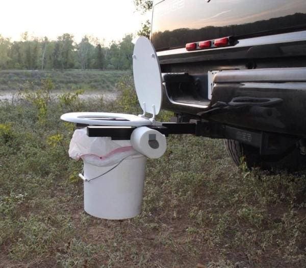 toilet seat attached to the back of a truck