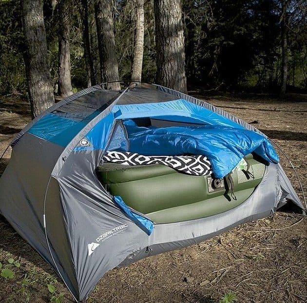 a tent with a full air mattress inside 