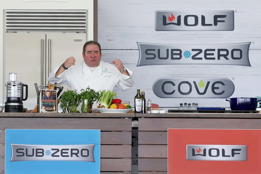 Emeril Lagasse in front of the stovetop and lots of vegetables at the King’s Hawaiian Cookoff in Miami Beach. 