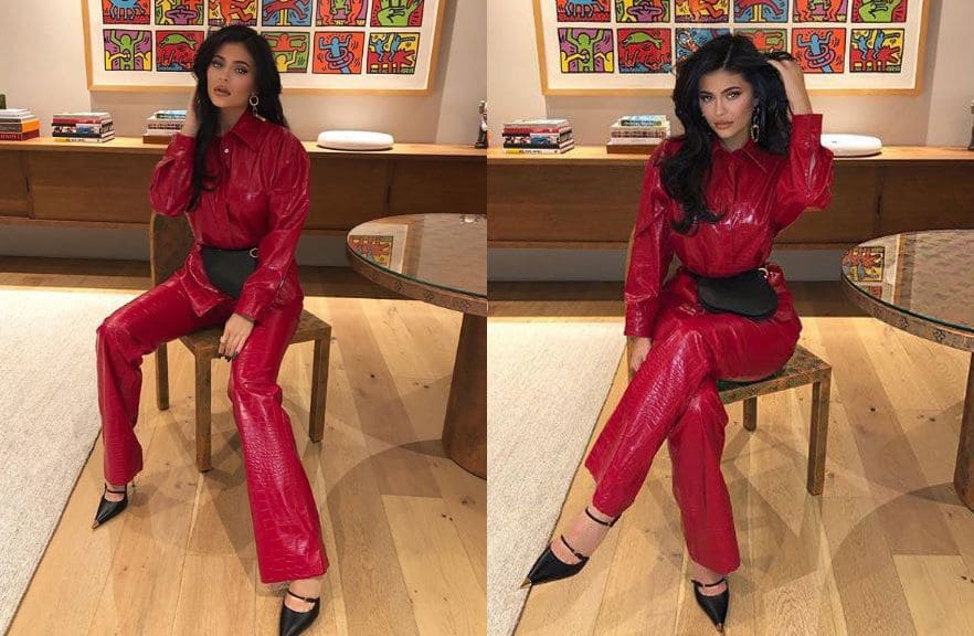 Photos of Kylie Jenner in a red leather suit with black pointed heels. 