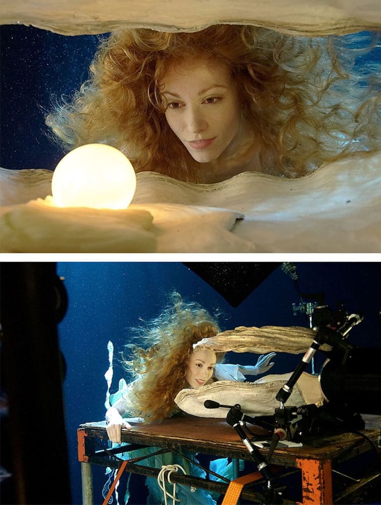 A girl underwater looking at a pearl/ a photo being taken of a girl underwater 