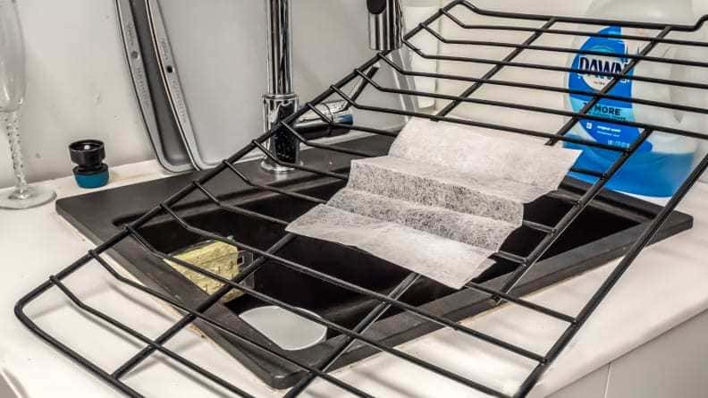 Remove grime from oven racks with dryer sheets. 