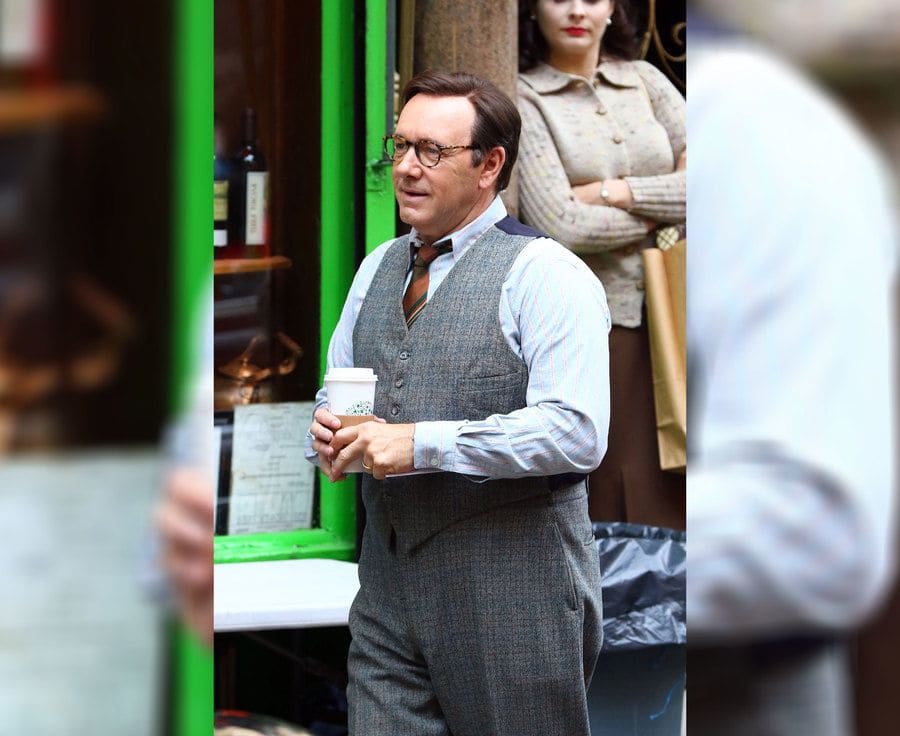 Kevin Spacey walking around with a hot cup of Starbucks coffee. 