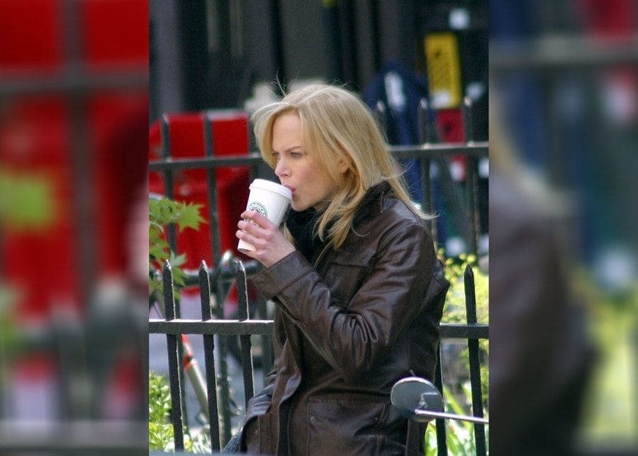 Nicole Kidman was warming up with a cup of Starbucks coffee on the set of the Interpreter. 