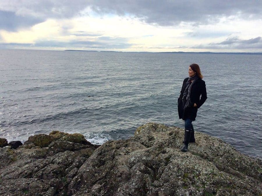 Berni Slowey standing in front of the ocean 