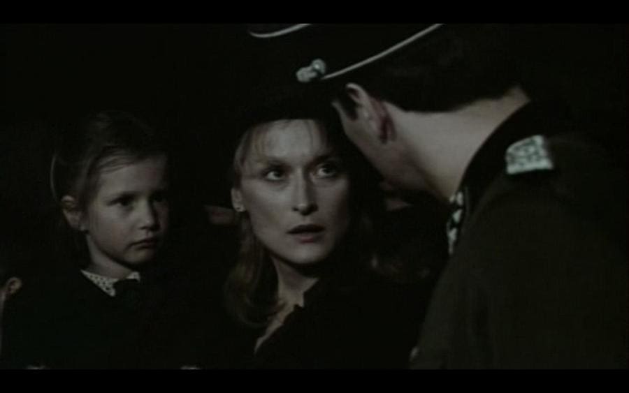 Meryl Streep and Jennifer Lawn Lejeune being spoken to by a Nazi officer. 