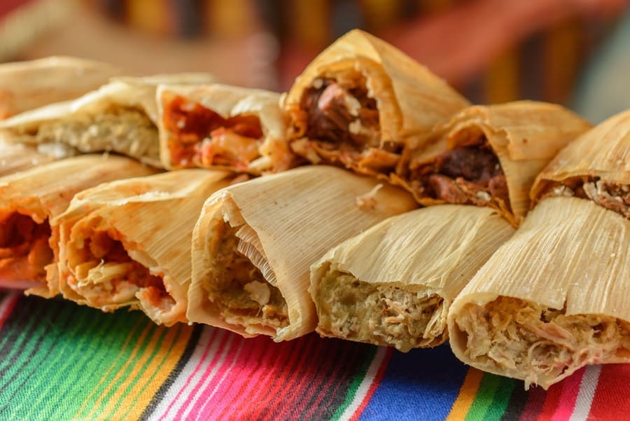Traditional tamales stuffed with an assortment of food.