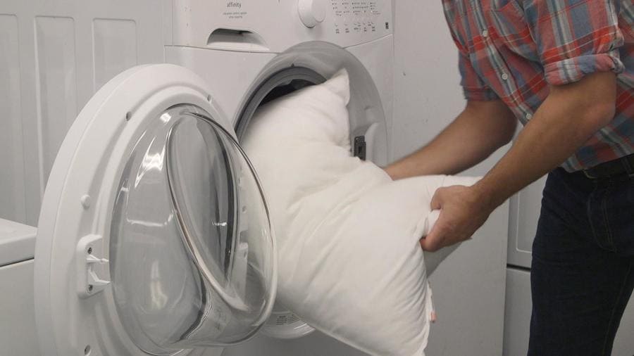 Inserting a Pillow into a washing machine