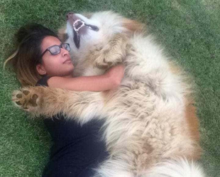 Yumna and her pet hugging