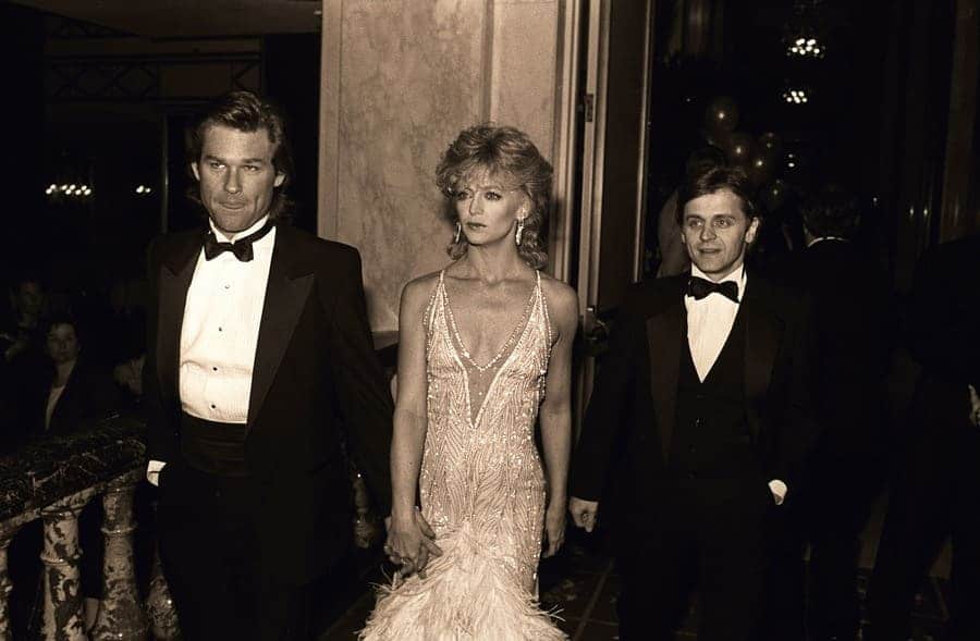 Kurt Russell and Goldie Hawn at the American Ballet Theatre Gala walking in front of Mikhail Baryshnikov in 1985.