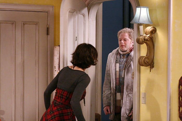 Jesse Tyler Ferguson is covered in white powder standing in the doorway in 'The Class,' 2006.