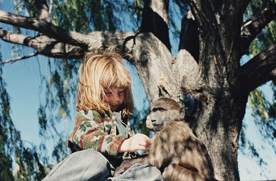 Tippi Degre playing with a monkey