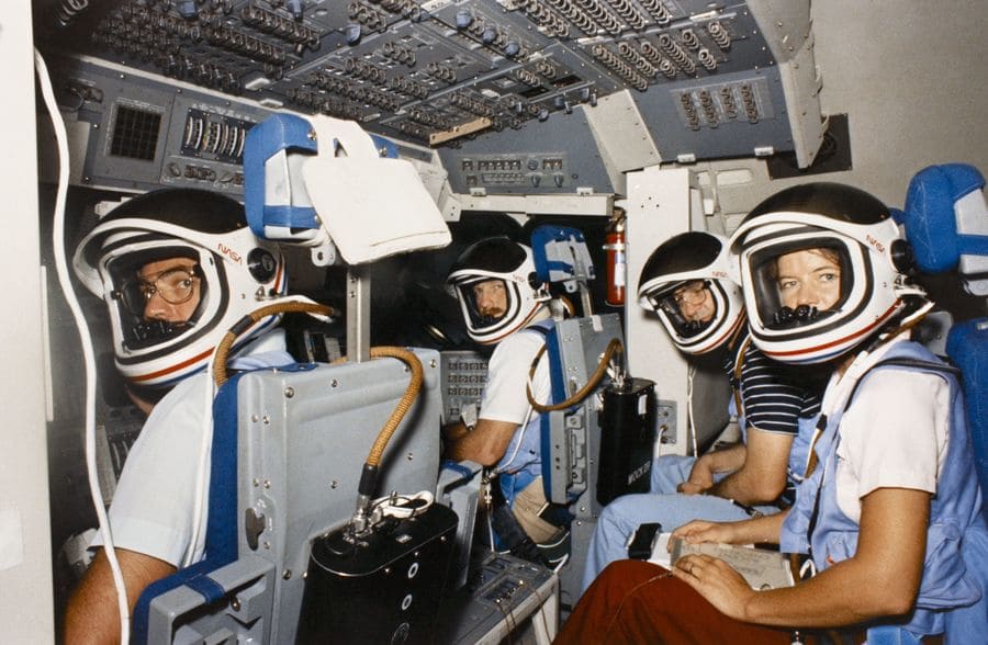 Robert Crippen, Frederick Hauck, John Fabian, and Sally Ride in the space shuttle simulator training in 1983.