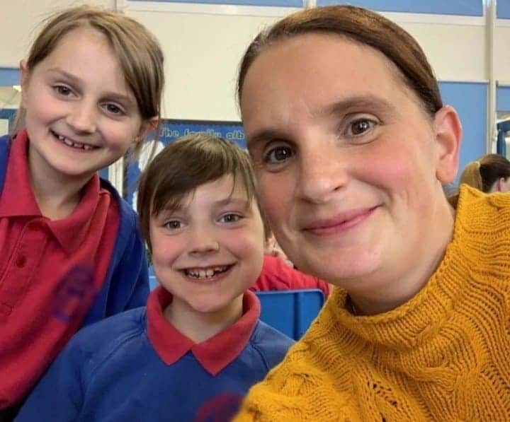 Sue Poses with Two of Her Children