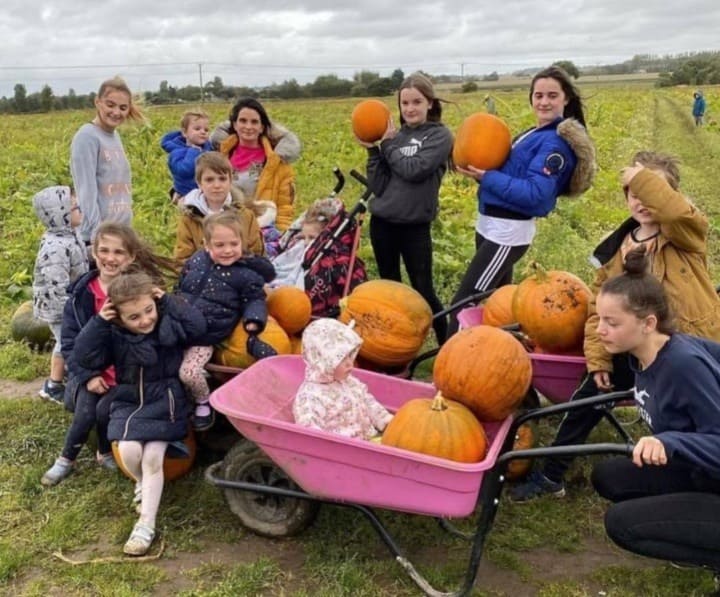 The Radford Family Pose with Pumpkins