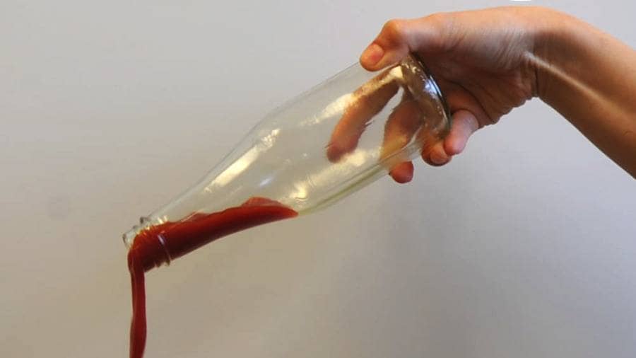 Someone is now easily pouring out the last drops of ketchup from a bottle.
