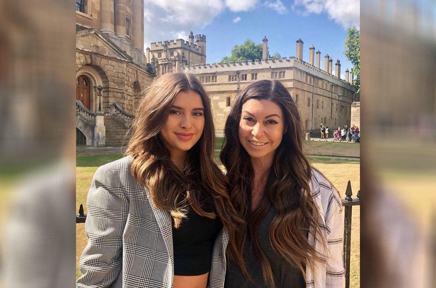 Kalani and her mother, Kira, in front of some older buildings. 