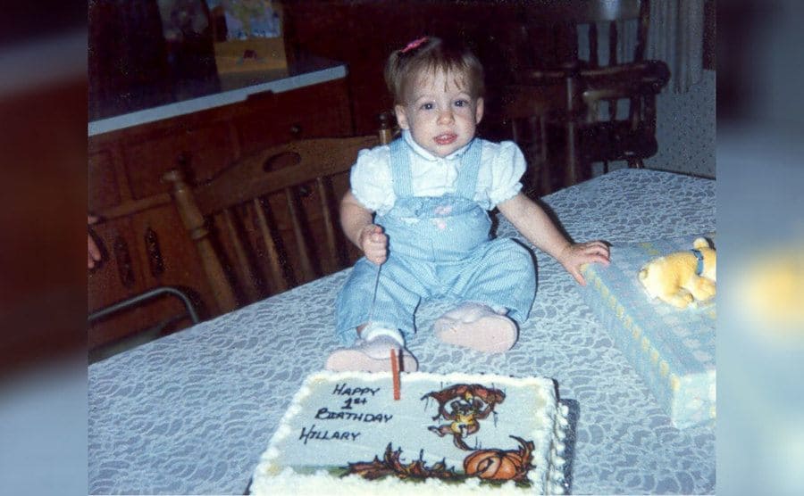 Hillary Harris on her first birthday with a cake 