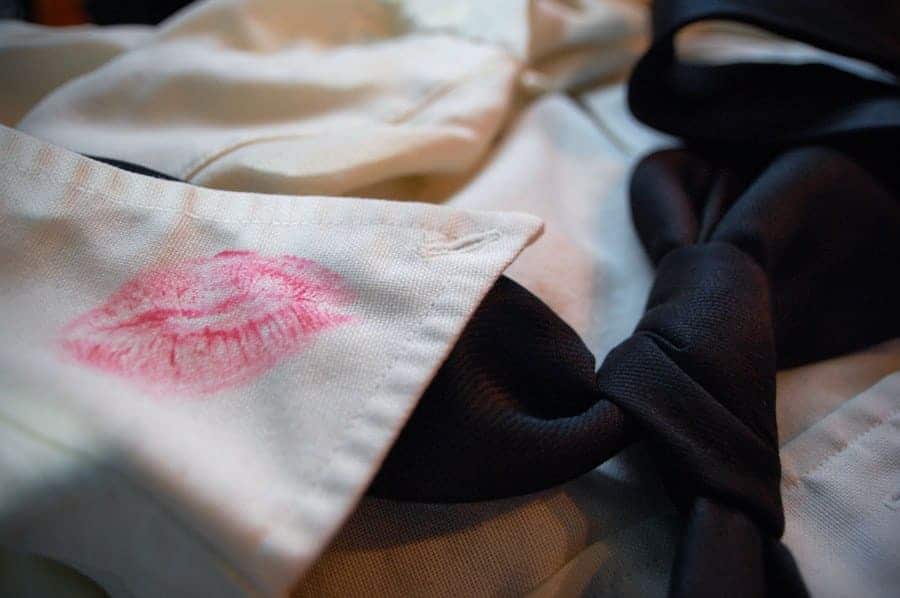 Lipstick stain on the collar of a men's dress shirt.