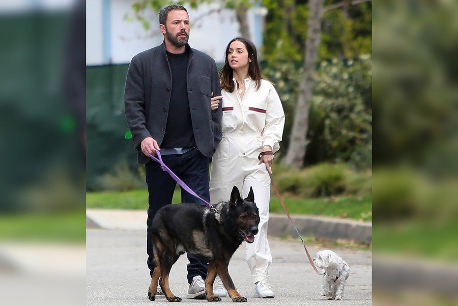 Ana De Armas and Ben Affleck having a conversation while walking her dog