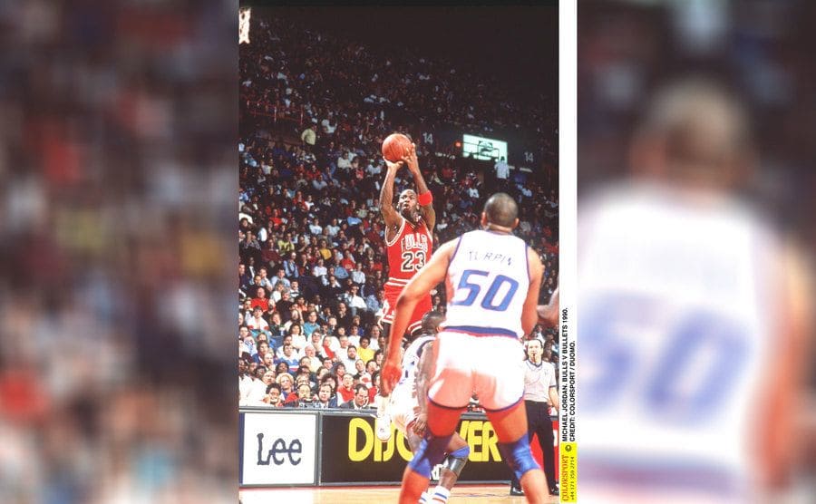 Michael Jordan making a shot in the Bulls vs. Bullets game in 1990
