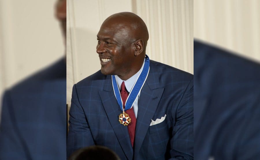 Michael Jordan is smiling after being presented with a Medal of Freedom