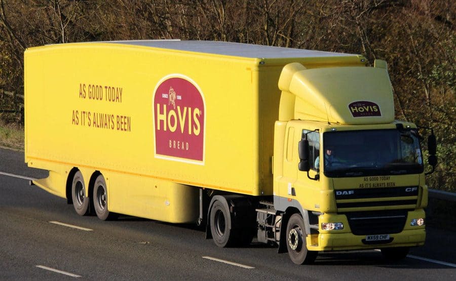A yellow truck with ‘Hovis Bread, As Good Today As It’s Always Been’ written on the side. 