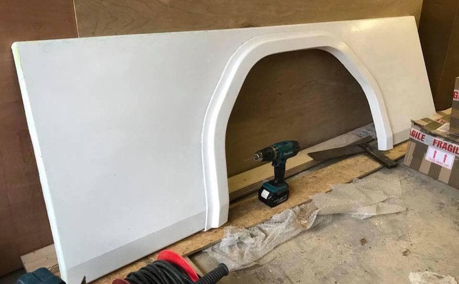 Fiberglass wheel arch panels which were made to replace the old ones in the mobile home. 